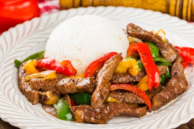 A plate of fried beef rice with green pepper