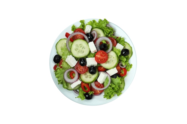 Plate of greek salad isolated on white