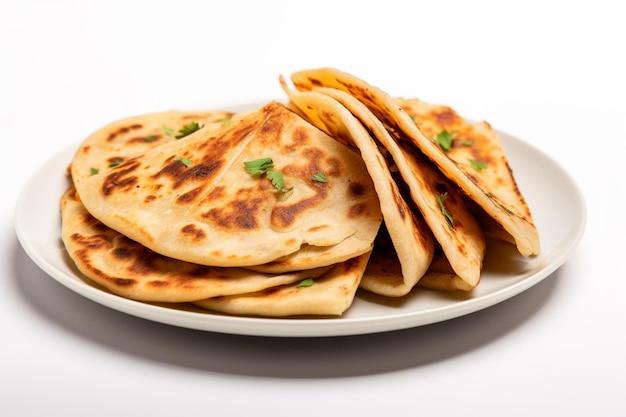 A plate of indian food with a plate of naan on it