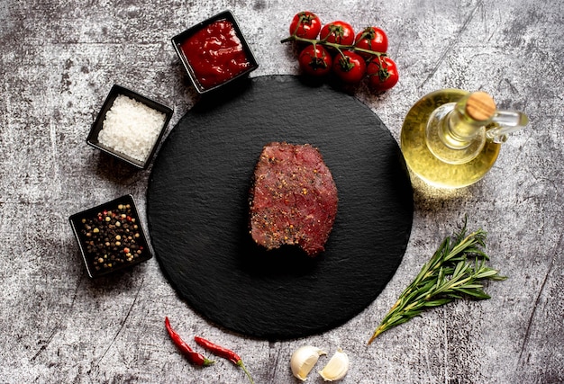 A plate of meat with a glass of wine and a glass of wine.