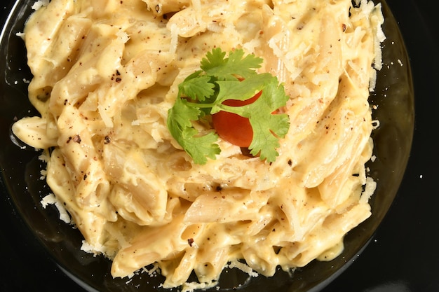 a plate of pasta with delicious alfredo sauce, delicious fast food meals, Arabic restaurants.