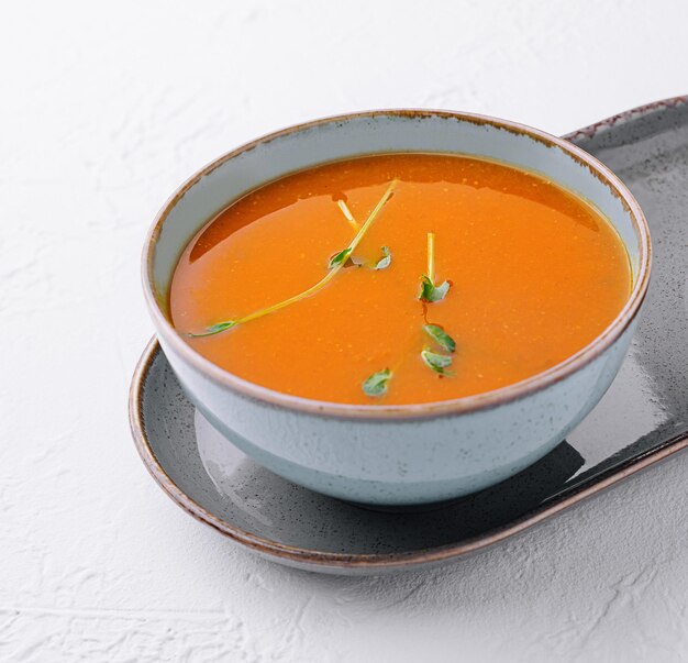 plate of pumpkin cream soup top view