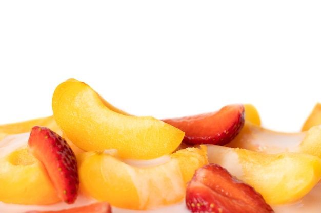 A plate of sliced fruit with a white background