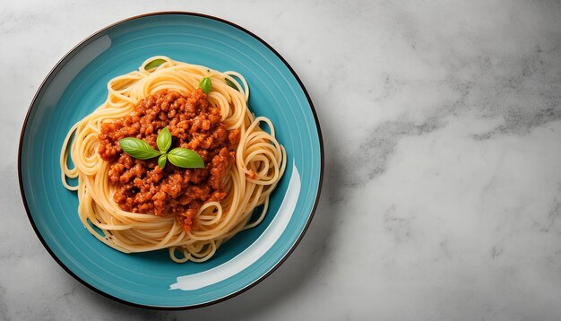 a plate of spaghetti with a green leaf on top of it