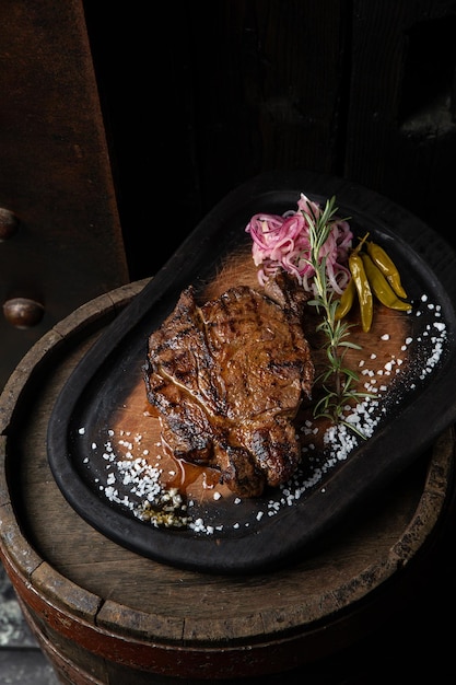 A plate of steaks with a sauce on it