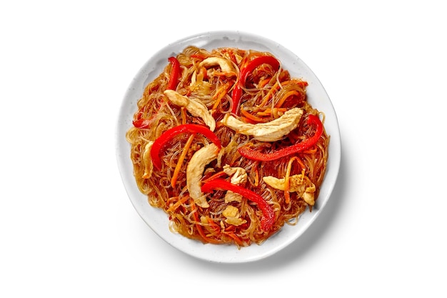 Plate of stir fried spicy rice noodles with beef bell peppers and carrots