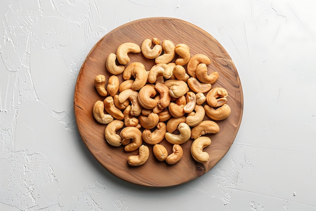 Photo plate of tasty cashew with on white background