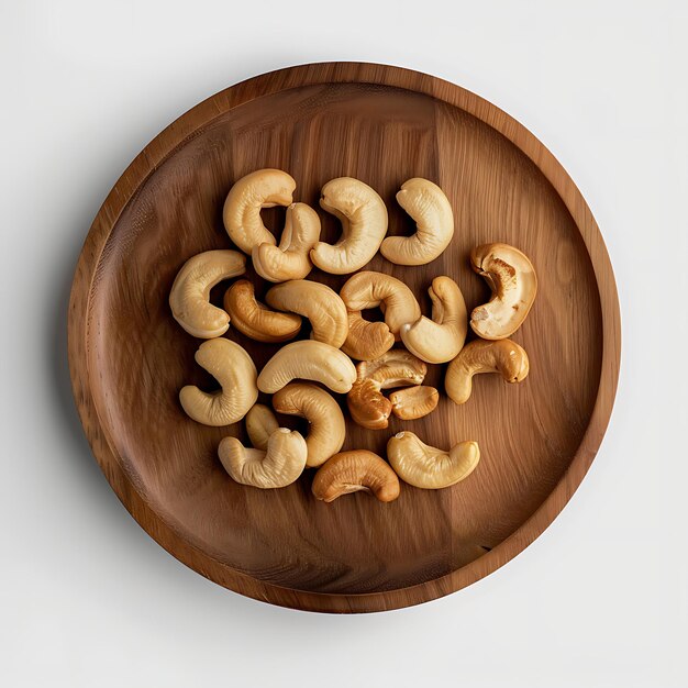 Photo plate of tasty cashew with on white background