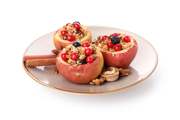 Plate with baked apples isolated on white background