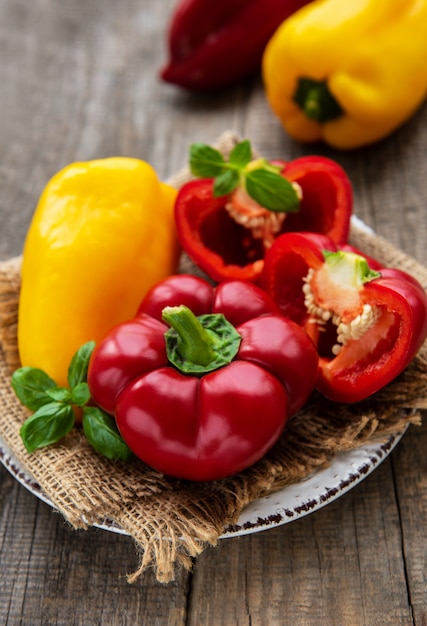 Plate with Bell peppers on a wooden background