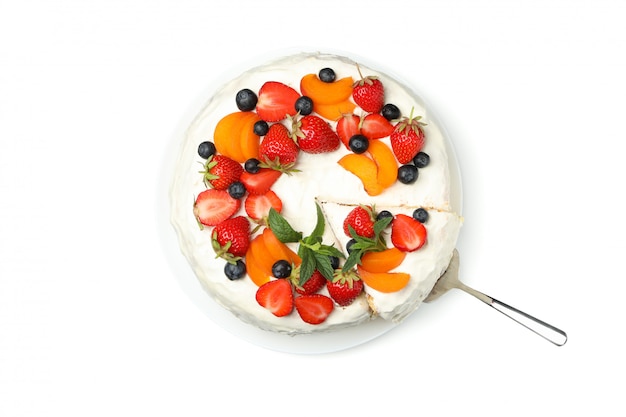 Plate with berry cream cake isolated on white background