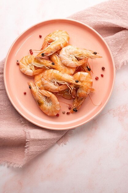 Plate with boiled shrimps with spices cooked prawns