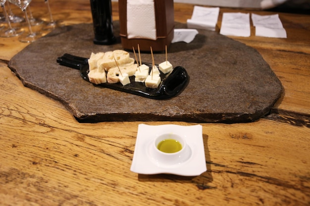 plate with cheese and bread for wine