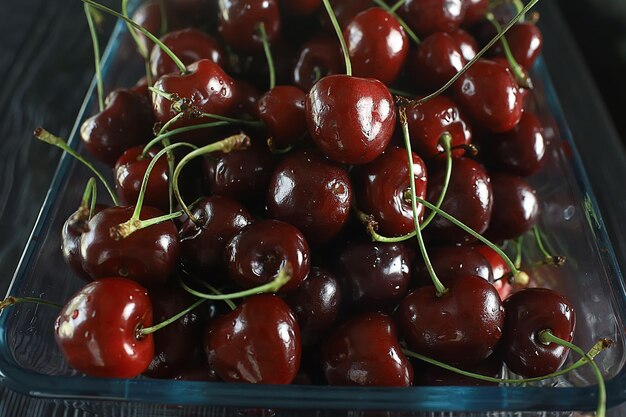 plate with cherry background / beautiful bright background fresh cherry cherries, juicy fruit