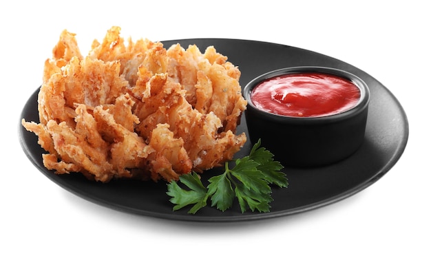 Plate with fried blooming onion and sauce isolated on white