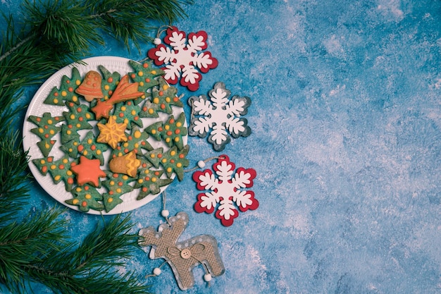 A plate with handpainted Christmas gingerbread and icing