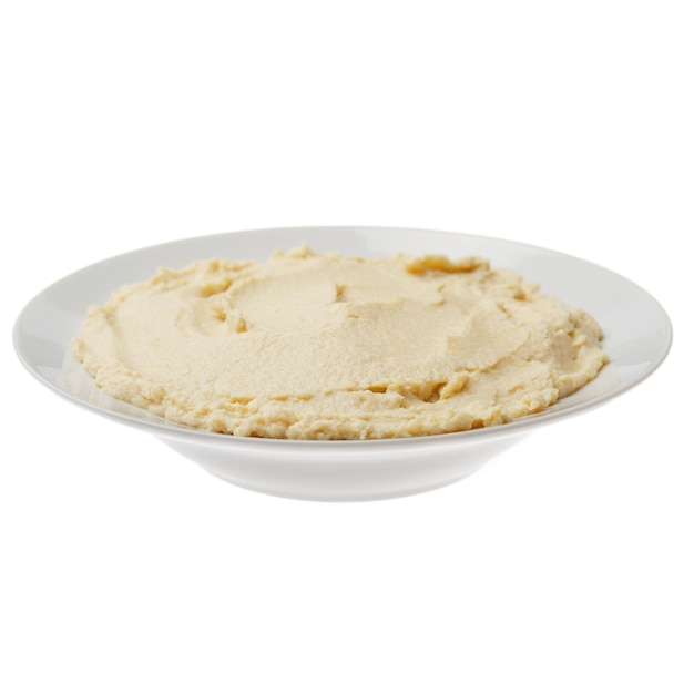 Plate with hummus spread made from cooked mashed chickpeas