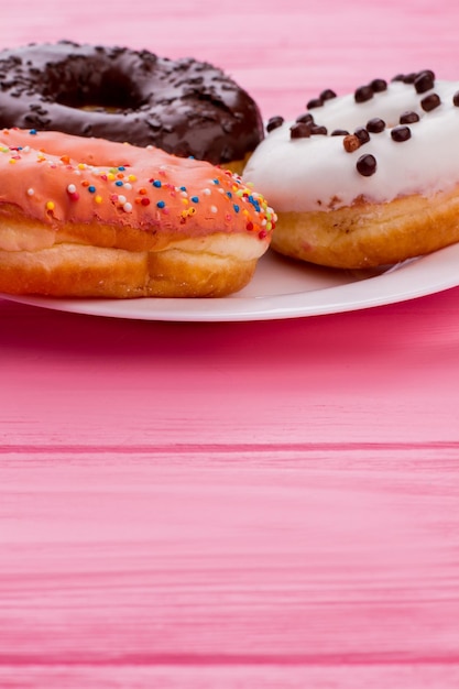 Plate with iced cakes, copy space.