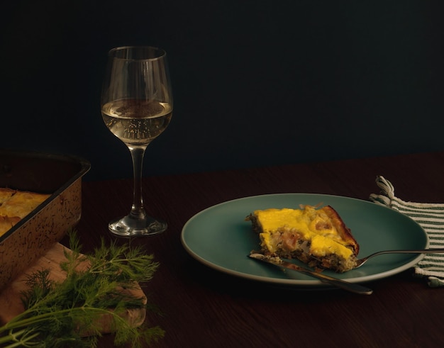 plate with pie and a glass of wine