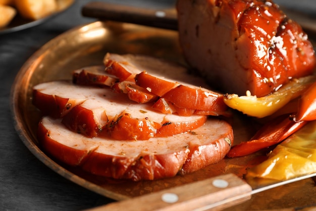 Plate with sliced honey baked ham closeup