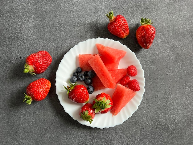 A plate with a spring snack in the form of fruit