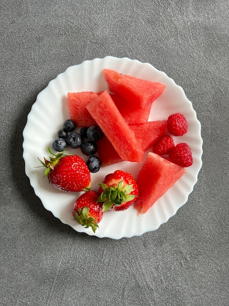 A plate with a spring snack in the form of fruit