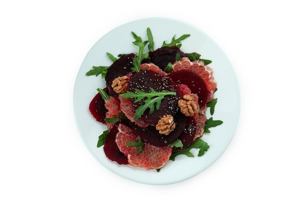 Plate with tasty beet salad isolated on white background