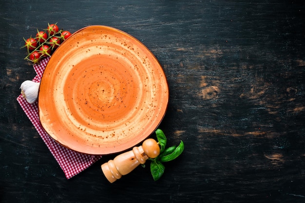 A plate on a wooden table Table service concept On a wooden background Top view Free copy space