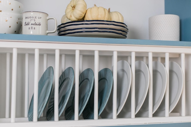 Plates in a shelf in the kitchen