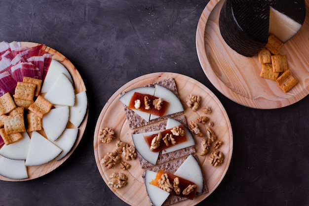 Plates with jamon cheese roasted bread and quince jelly