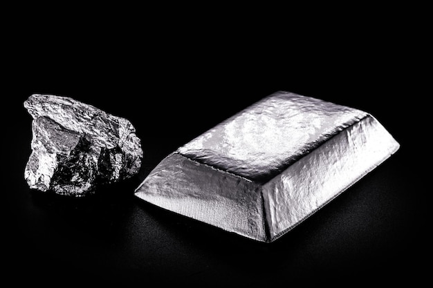 Platinum ingot and nugget noble metal used in the production of catalysts luxury jewelry isolated black background