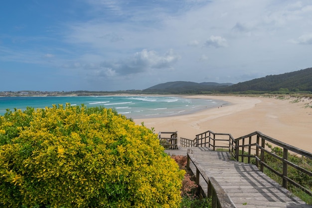 Playa de San Jorge Ferrol and the wooden walkway that leads down to the beach