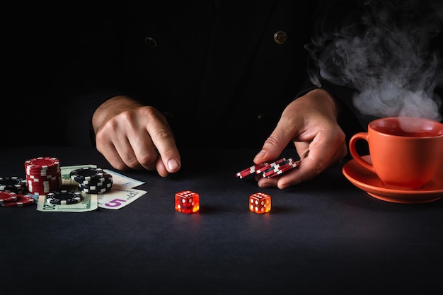 A player places a bet with chips on a winning combination when playing craps in a poker club