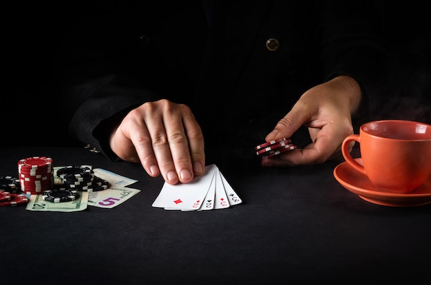 The player shows cards with a winning combination of two pairs in a poker club