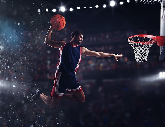 Player throws the ball in the basket in the stadium full of spectators