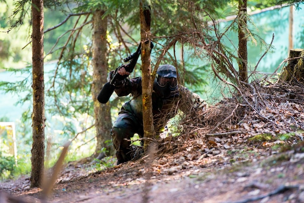 Players in paintball prepare for fight