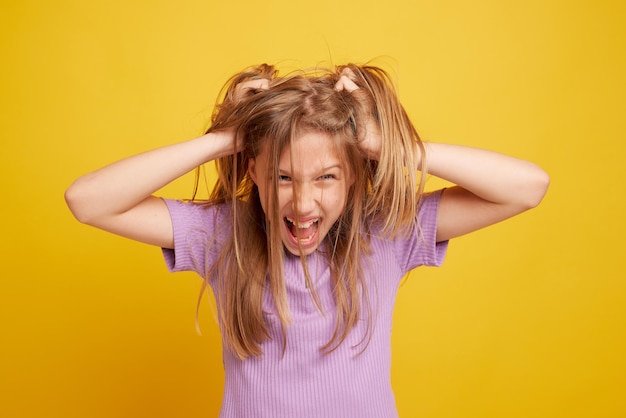 Playful young girl grimacing at camera closeup horizontal website header banner design copy space