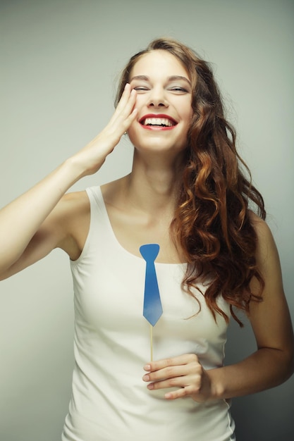 Playful young woman ready for party