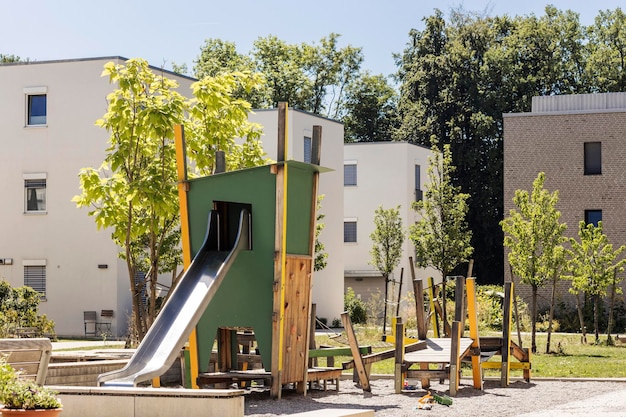 Playground in Public Yard. Modern Playground for Childrens in Public housing. Modern Kid Slide.