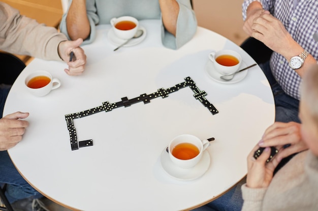 Playing dominoes over cup of tea