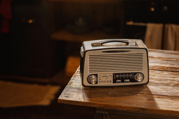 Playing loud music fm channel stylish retro radio player stands on a wooden table stylish kitchen