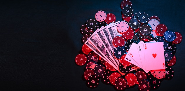 Playing poker chips, cards and smoke-filled money