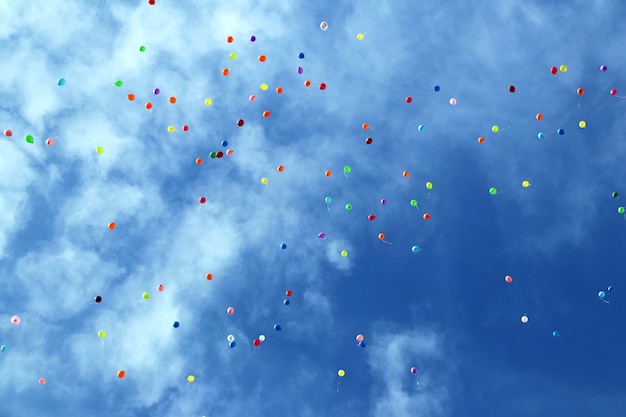 Plenty of multicolored balloons in the blue sky