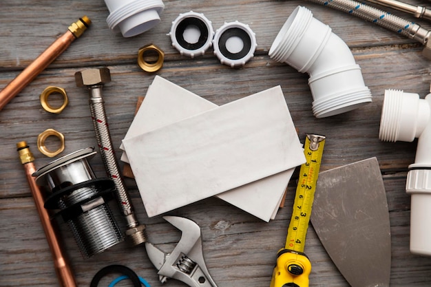 Plumbing tools and tiles home improvement background