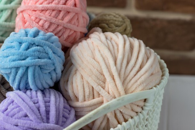 Plush yarn Basket with tangles of thread Knitting Day in Public