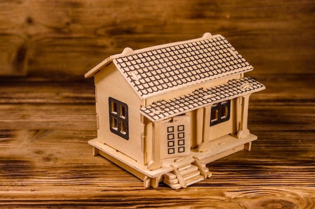 Plywood model of the house on wooden table