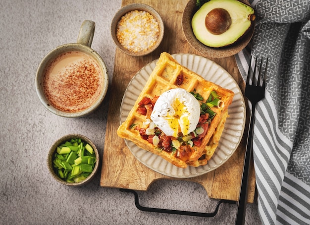 Poached egg on belgian waffles, coffee, breakfast, top view