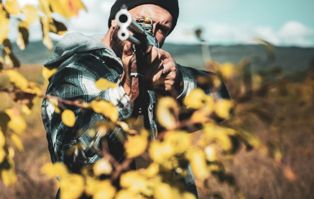 Photo poacher with rifle spotting some deers hunting is the practice of killing or trapping animals