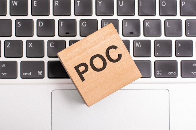 POC inscription concept on cube on keyboard