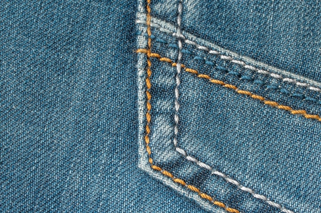 Pocket of blue jeans old jeans closeup